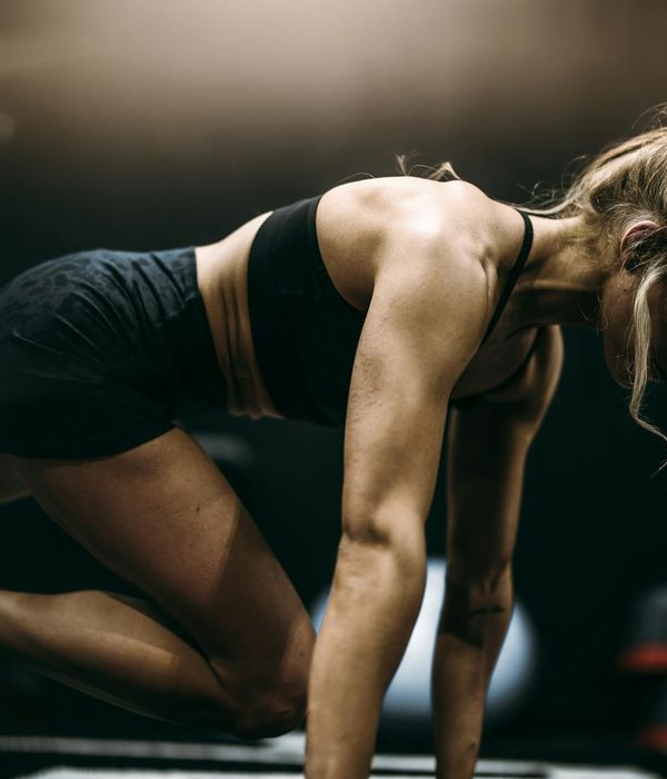 Woman performing a calm cardio exercise in a serene environment.